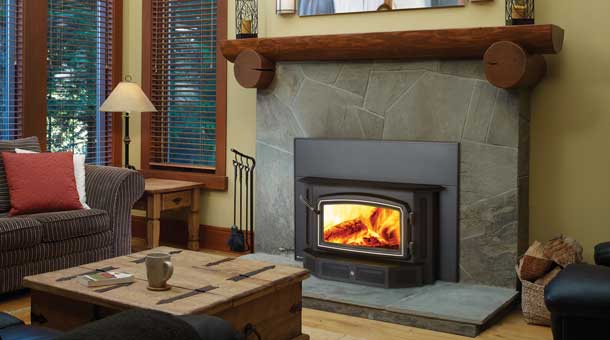 Regency 12400 Wood Fireplace insert in rustic living room against stone surround
