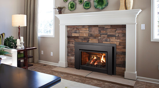 Regency U31 Gas Fireplace Insert with white mantel and stone surround
